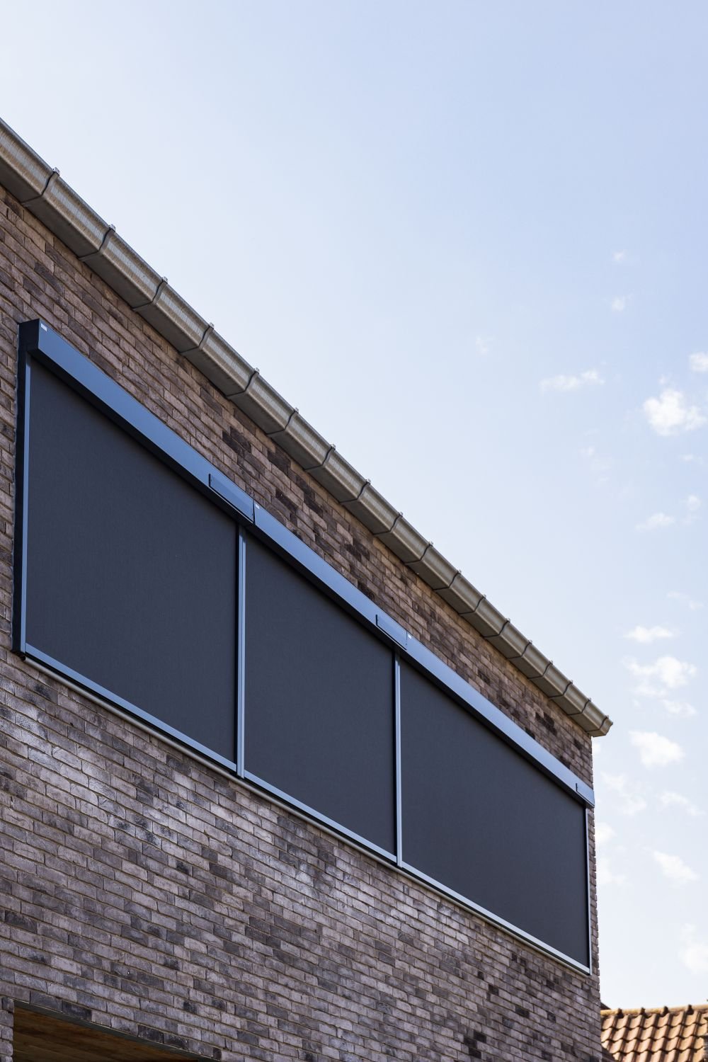 Kent-Solar-Powered-ZIP-Screens-England-Wales Solar powered ZIP screens installed on a modern residential property